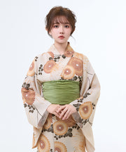 Woman wearing a traditional kimono with floral patterns on a white background