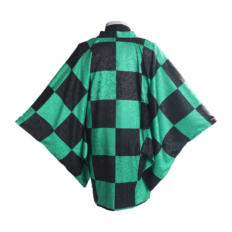 Green and black checkered cape on a mannequin against a white background